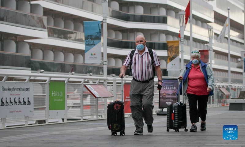 Passengers disembark from the Holland America Koningsdam cruise ship after the ship docked at the Canada Place cruise terminal in Vancouver, British Columbia, Canada, on April 10, 2022.Photo:Xinhua