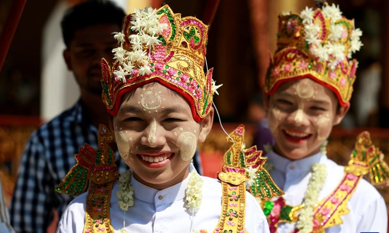 Boys in traditional attire attend the Shinbyu novitiation ceremony at Shwedagon Pagoda in Yangon, Myanmar, April 10, 2022. The Shinbyu novitiation ceremony is an essential part in a life of a male Myanmar Buddhist under the age of 20.Photo:Xinhua