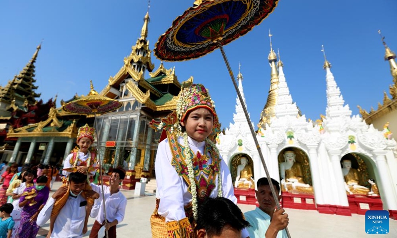 A boy in traditional attire attends the Shinbyu novitiation ceremony at Shwedagon Pagoda in Yangon, Myanmar, April 10, 2022.Photo:Xinhua