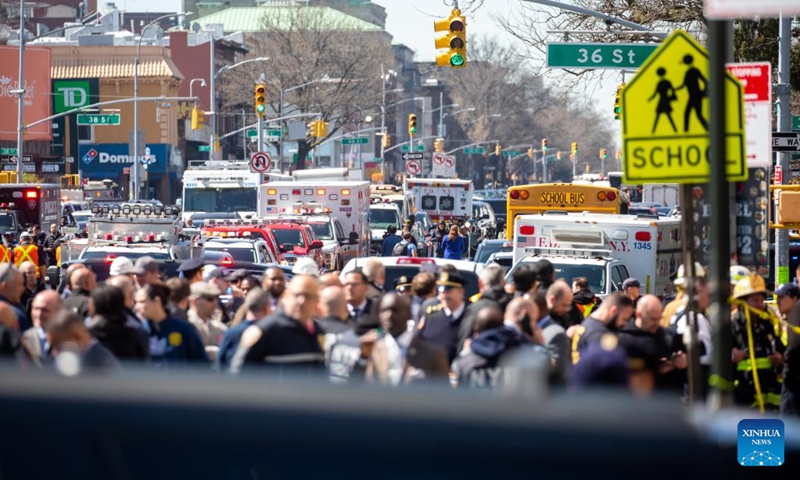 First responders work at a nearby street after a shooting took place at a subway station in Brooklyn, New York, the United States, on April 12, 2022. At least five people were shot and 13 were injured on Tuesday morning at the subway station in Brooklyn, local media reported, citing law enforcement sources.(Photo: Xinhua)