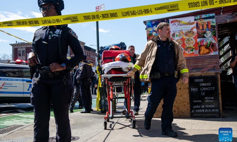 First responders work at a nearby street after a shooting took place at a subway station in Brooklyn, New York, the United States, on April 12, 2022. At least five people were shot and 13 were injured on Tuesday morning at the subway station in Brooklyn, local media reported, citing law enforcement sources.(Photo: Xinhua)