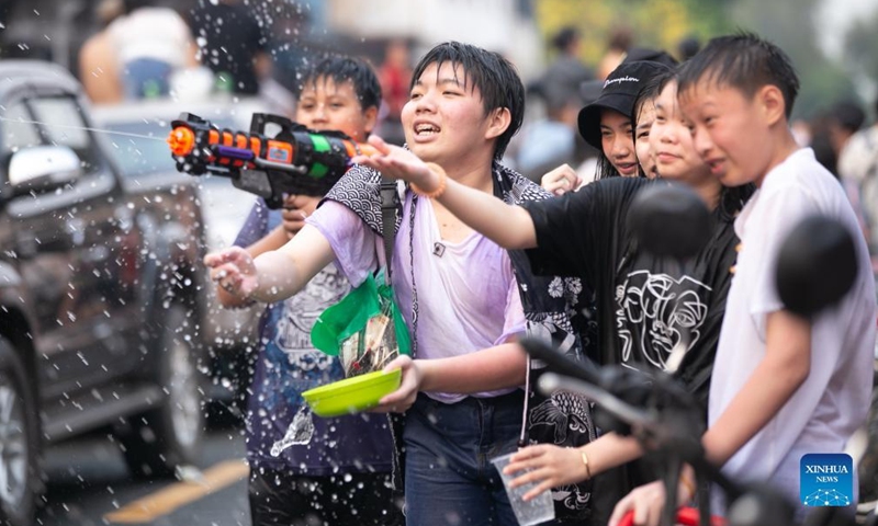 People splash water to each other to celebrate the Songkran Festival, or the Lao New Year, in Luang Prabang, Laos, April 16, 2022. Laos celebrated Songkran from April 14 to 16.Photo:Xinhua