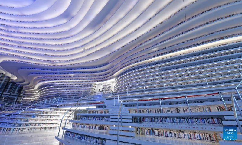 Photo taken on April 20, 2022 shows the interior view of the Tianjin Binhai Library in Tianjin, north China.

The library, a cultural landmark of Tianjin, officially opened to the public in October of 2017. Its stunning design has received a lot of attention from the public. (Xinhua/Zhao Zishuo)