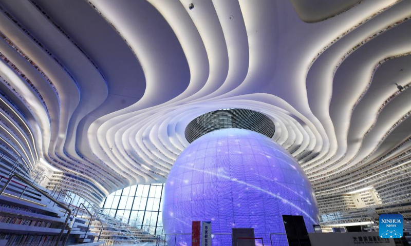 Photo taken on April 20, 2022 shows the interior view of the Tianjin Binhai Library in Tianjin, north China.

The library, a cultural landmark of Tianjin, officially opened to the public in October of 2017. Its stunning design has received a lot of attention from the public. (Xinhua/Zhao Zishuo)