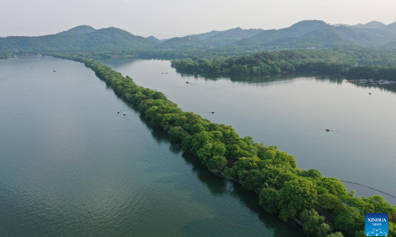 Aerial photo taken on April 12, 2022 shows a view of the West Lake scenic area in Hangzhou, east China's Zhejiang Province. West Lake is famous for its picturesque scenery as well as the historic relics. West Lake was added to the UNESCO World Heritage List in 2011. (Photo: Xinhua)