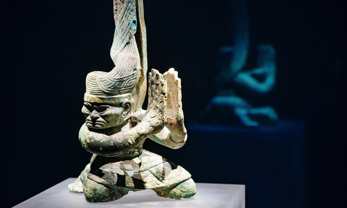 A statue in a kneeling position with its head turned on display at the Sichuan Museum in Chengdu, the capital of Southwest China's Sichuan Province, on September 28, 2021.Photo: VCG