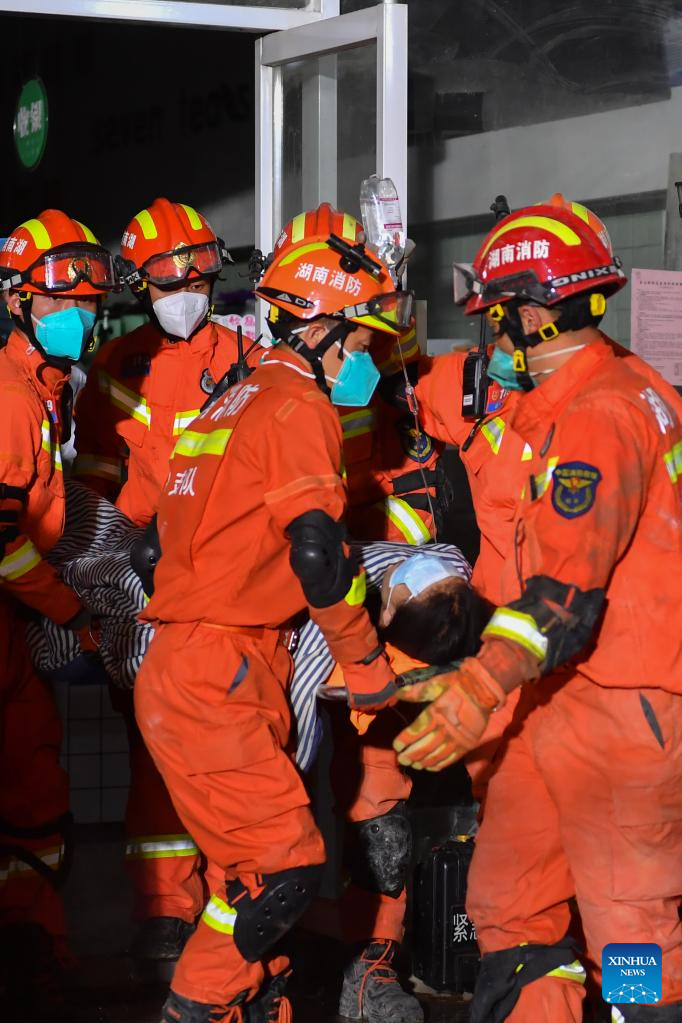 Rescuers transfer the ninth survivor who has been pulled from the rubble 88 hours after a self-built residential building collapsed in Changsha, central China's Hunan Province, May 3, 2022. A self-constructed residential building collapsed on April 29 in Wangcheng District in Changsha. (Xinhua/Chen Zeguo)