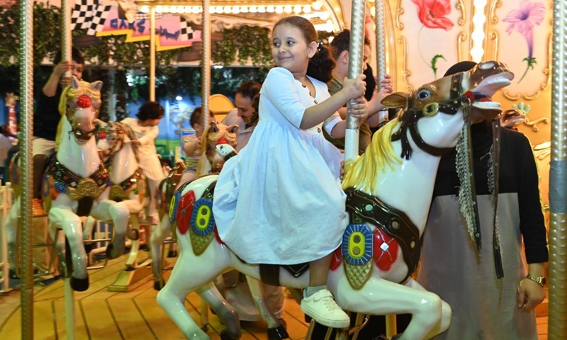 Children spend time at a playground during the Eid al-Fitr celebrations in Hawalli Governorate, Kuwait, on May 2, 2022.Photo:Xinhua