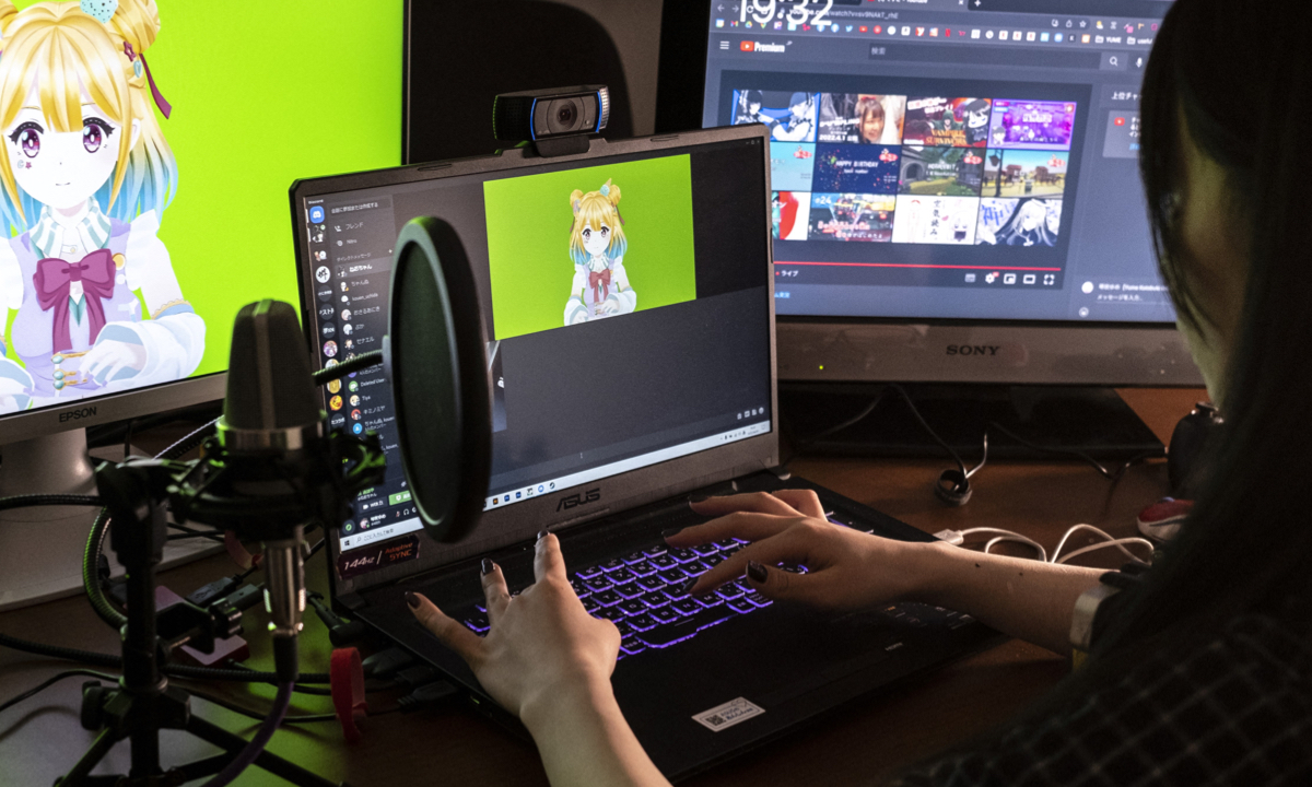 Mayu Iizuka, a virtual YouTuber who voices and animates a character called Yume Kotobuki, poses before a livestream at a studio in Tokyo on April 7, 2022. Photos: AFP