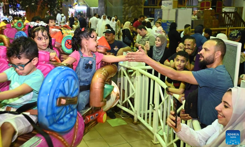 Children spend time at a playground during the Eid al-Fitr celebrations in Hawalli Governorate, Kuwait, on May 2, 2022.Photo:Xinhua