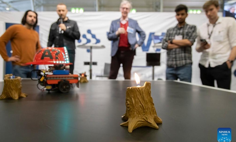 Contestants show their robots during a competition for university students at Technology Fair 2022 in Helsinki, Finland on May 4, 2022. The event is held from May 3 to 5 at the Helsinki Fair Center. The theme of this year's event is Solutions for a Sustainable Tomorrow.Photo:Xinhua