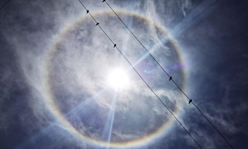 Cellphone photo taken on May 1, 2022 shows a solar halo over Tuiwa Village in Nagarze County in Shannan, southwest China's Tibet Autonomous Region. With an altitude of 5,070 meters, Tuiwa Village is located at the foot of the Mongda Kangri Mountain and by the Puma Yumco Lake.(Photo: Xinhua)