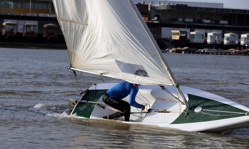 A member of the Iraqi national windsurfing team is training in the Tigris River in Baghdad, Iraq on May 08, 2022.(Photo: Xinhua)