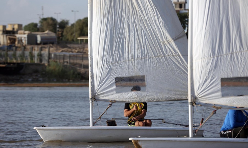 Members of the Iraqi national windsurfing team train in the Tigris River in Baghdad, Iraq on May 08, 2022.(Photo: Xinhua)