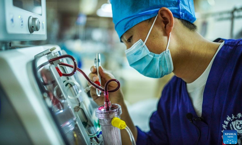 Nurse Wang Yin checks medical equipment at the ICU of the Affiliated Hospital of Guizhou Medical University in Guizhou, southwest China's Guiyang Province, May 10, 2022. The importance of male nurses is widely acknowledged as they are usually employed in labor-intense units such as ICUs, meaning frequent night shifts and long working hours.(Photo: Xinhua)