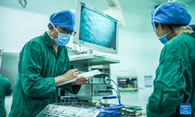 Nurse Zhang Guo checks the surgery equipments at an operating room at the Affiliated Hospital of Guizhou Medical University in Guizhou, southwest China's Guiyang Province, May 10, 2022. The importance of male nurses is widely acknowledged as they are usually employed in labor-intense units such as ICUs, meaning frequent night shifts and long working hours.(Photo: Xinhua)