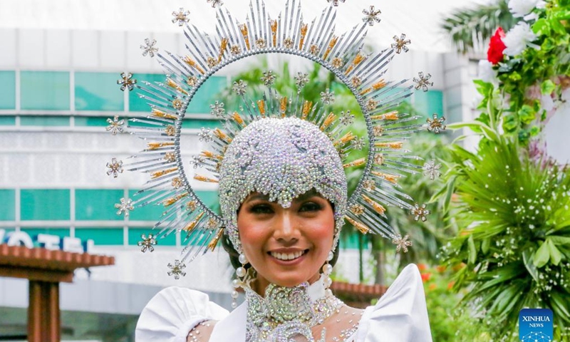 A contestant for the Binibining Pilipinas (Miss Philippines) 2022 participates in the Flores de Mayo (Flowers of May) procession in Quezon City, the Philippines, May 14, 2022. A total of 40 contestants will vie for the Binibining Pilipinas 2022 beauty pageant this year.Photo:Xinhua