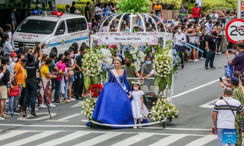 A contestant for the Binibining Pilipinas (Miss Philippines) 2022 participates in the Flores de Mayo (Flowers of May) procession in Quezon City, the Philippines, May 14, 2022. A total of 40 contestants will vie for the Binibining Pilipinas 2022 beauty pageant this year.Photo:Xinhua