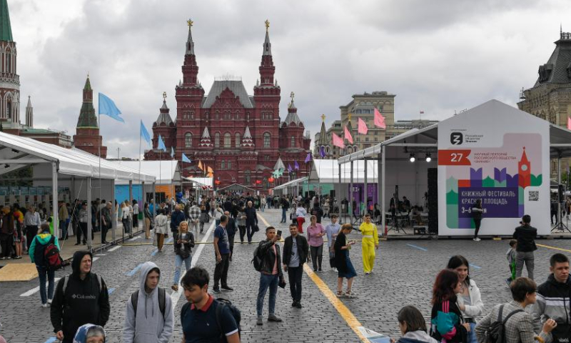 People attend the annual book festival on the Red Square in Moscow, Russia, on June 3, 2022. (Photo by Alexander Zemlianichenko Jr/Xinhua)