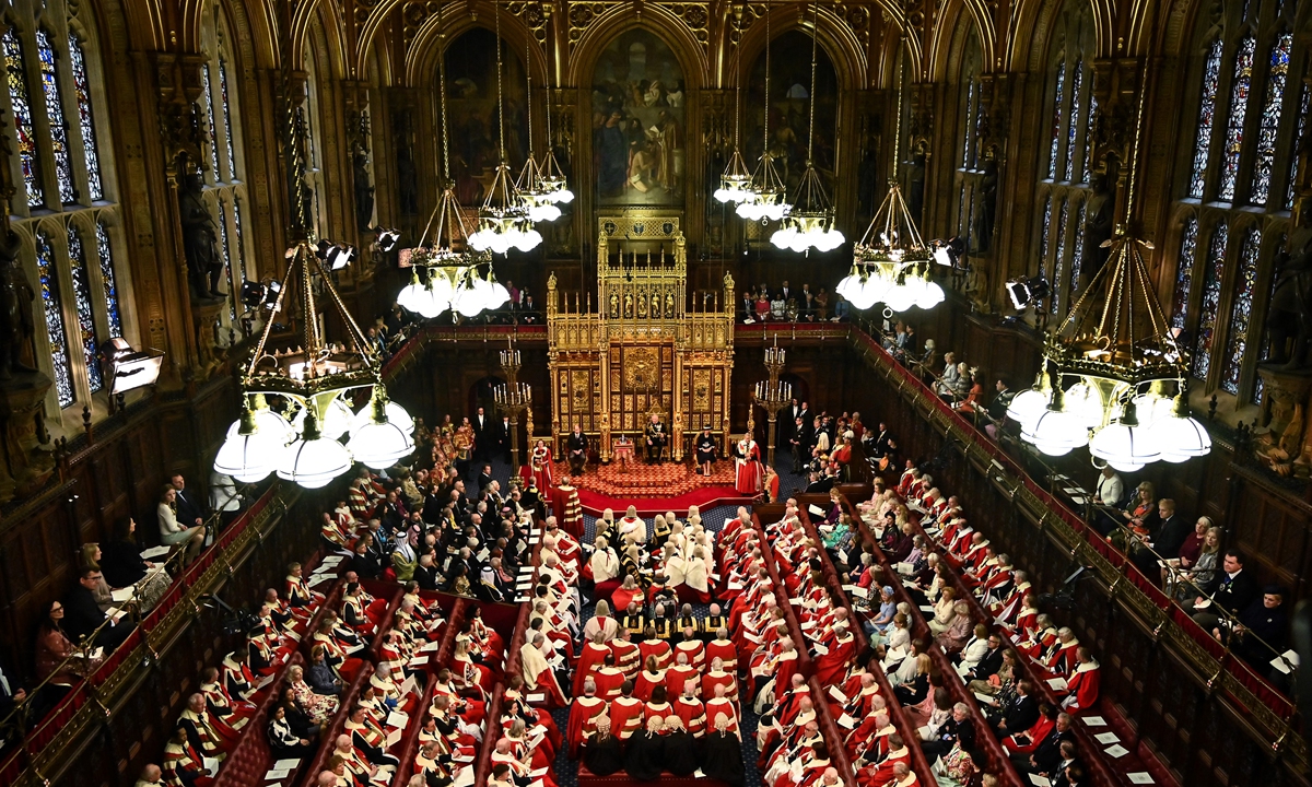 Britain's Prince Charles, Prince of Wales (center) reads the Queen's Speech at the Houses of Parliament, in London on May 10, 2022. Photo: AFP