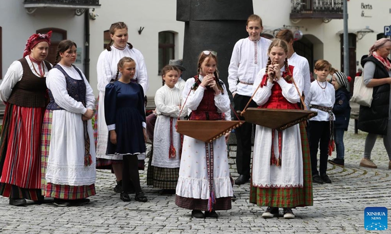 People in traditional costume perform during the 49th International Folklore Festival in Vilnius, Lithuania, on May 27, 2022.Photo:Xinhua