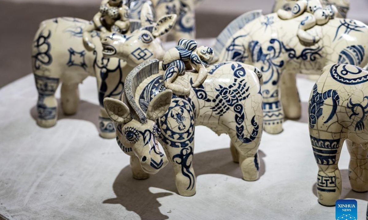 Visitors view an art exhibition dubbed Images of the Pioneers at Nepal Art Council in Kathmandu, Nepal, June 2, 2022. (Photo by Hari Maharjan/Xinhua)