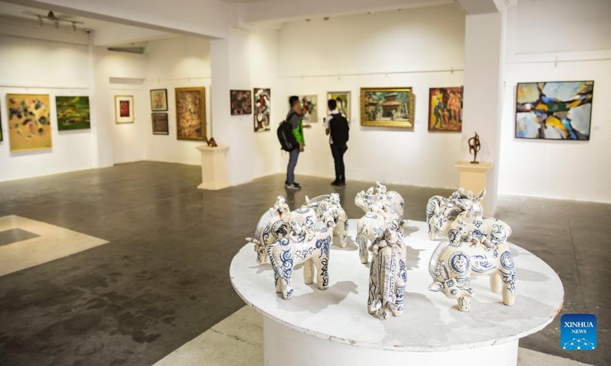 Visitors view an art exhibition dubbed Images of the Pioneers at Nepal Art Council in Kathmandu, Nepal, June 2, 2022. (Photo by Hari Maharjan/Xinhua)