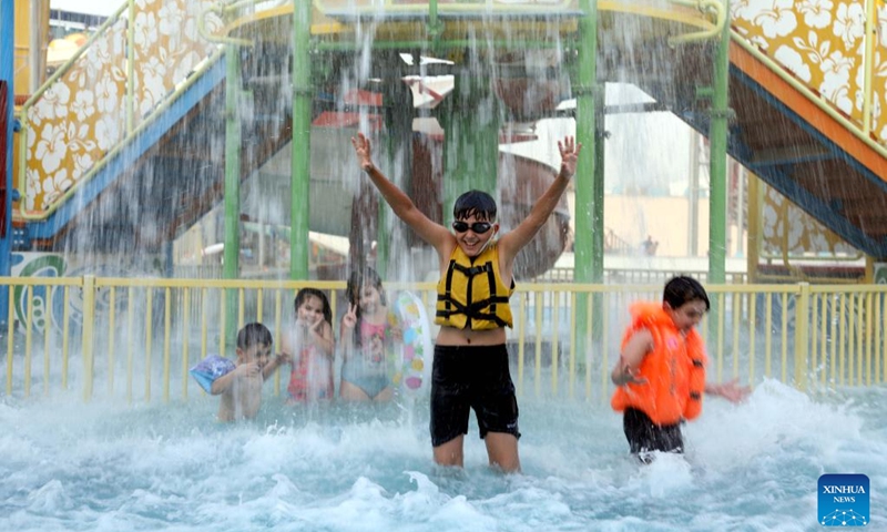 Children spend time at a water park during a hot day in Baghdad, Iraq, on June 20, 2022. Iraq witnessed hot weather recently, with the highest temperature soaring to 50 degrees Celsius in some regions of the country.(Photo: Xinhua)