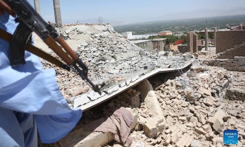 An Afghan security force member stands guard at a destroyed weapon cache of the Islamic State (IS) in Parwan province, Afghanistan, June 8, 2022. Security forces have found and destroyed a weapon cache of the Islamic State (IS) in Afghanistan's eastern Parwan province, provincial police spokesman Mohammad Kamran Habibi said on Tuesday.(Photo: Xinhua)