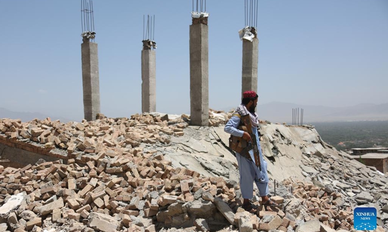 An Afghan security force member stands guard at a destroyed weapon cache of the Islamic State (IS) in Parwan province, Afghanistan, June 8, 2022. Security forces have found and destroyed a weapon cache of the Islamic State (IS) in Afghanistan's eastern Parwan province, provincial police spokesman Mohammad Kamran Habibi said on Tuesday.(Photo: Xinhua)