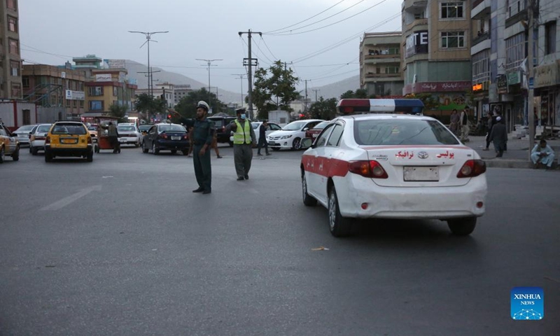 Policemen direct traffic near the site of a bicycle bomb explosion in Kabul, Afghanistan, June 6, 2022. Several people were wounded following a bicycle bomb explosion in the central part of Kabul, the capital of Afghanistan on Monday, the capital police confirmed.(Photo: Xinhua)