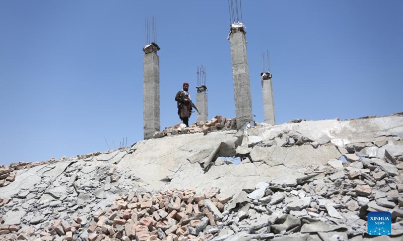 An Afghan security force member stands guard at a destroyed weapon cache of the Islamic State (IS) in Parwan province, Afghanistan, June 8, 2022. Security forces have found and destroyed a weapon cache of the Islamic State (IS) in Afghanistan's eastern Parwan province, provincial police spokesman Mohammad Kamran Habibi said on Tuesday.(Photo: Xinhua)