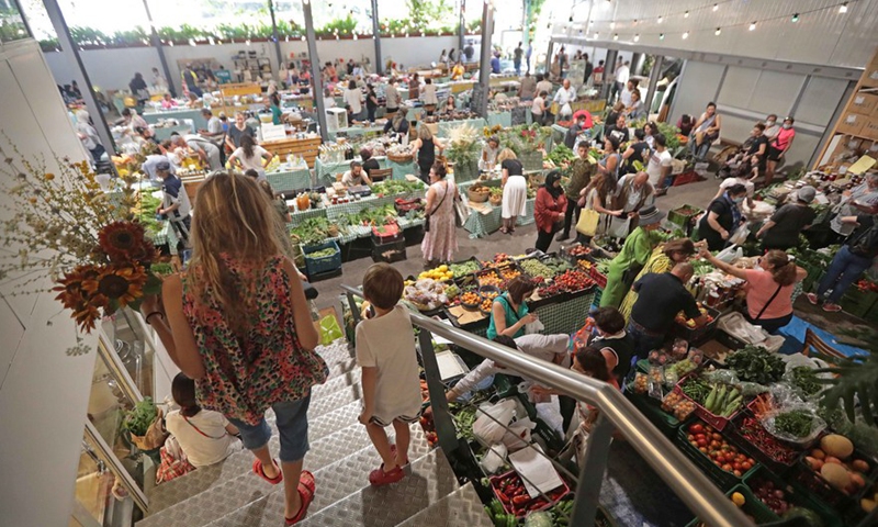 People shopping at Souk El Tayeb in Beirut, Lebanon, on June 11, 2022.Photo:Xinhua