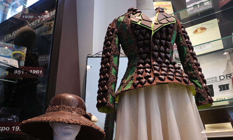 A hat and a jacket made from chocolate are displayed in the Belgian Chocolate Village in Brussels, Belgium, June 9, 2022.Photo:Xinhua