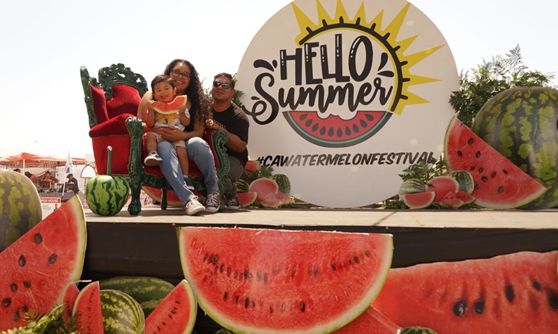 People take part in the 2022 California Watermelon Festival in Los Angeles, California, the United States, on June 12, 2022.(Photo: Xinhua)