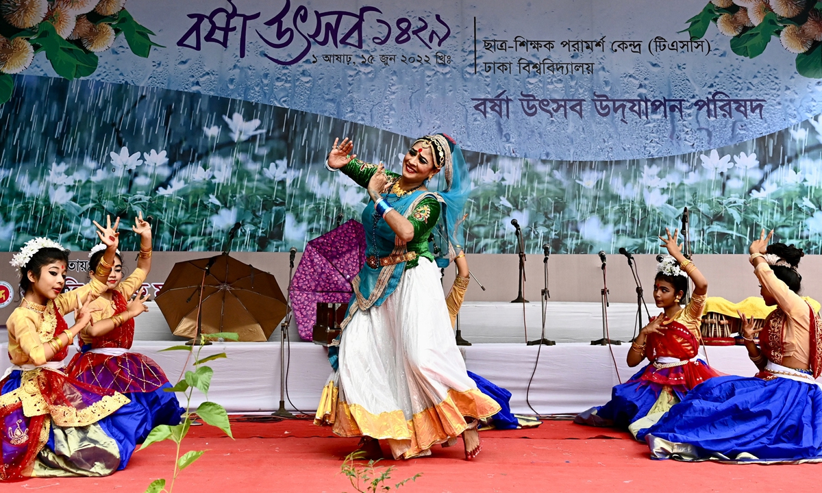 Performers dance during a ceremony to celebrate start of the monsoon season in Dhaka, Bangladesh on June 15, 2022. This day is marked with colorful celebration, including singing performances, drama, poetry recitation, screening of cinemas on rain, puppet show, Hilsha Fest and many other programs. Photo: AFP