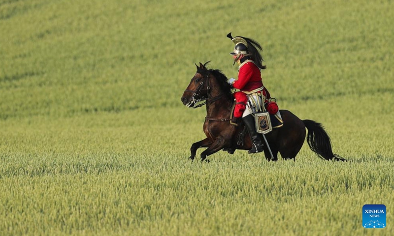 A re-enactor performs during the re-enactment of the 1815 Battle of Waterloo in Waterloo, Belgium, June 18, 2022.Photo:Xinhua