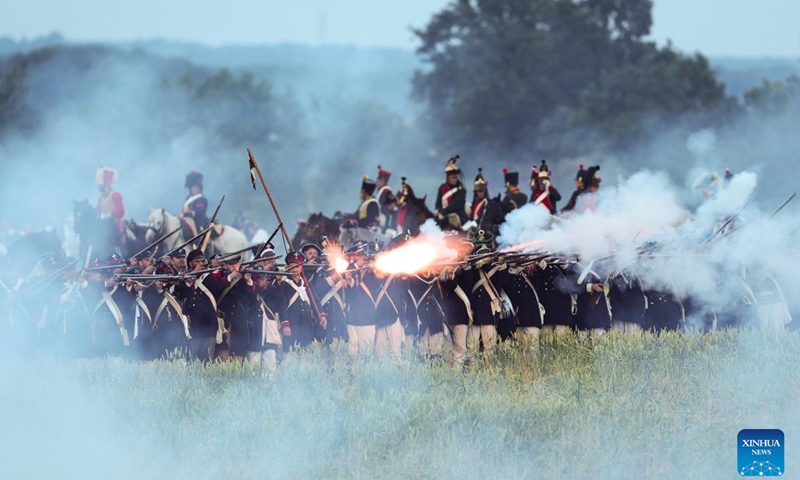 Re-enactors attend the re-enactment of the 1815 Battle of Waterloo in Waterloo, Belgium, June 18, 2022. About 2,000 re-enactors, more than 100 horses as well as over 20 canons participated in the re-enactment, showing the clash of June 18, 1815 between Napoleon and Wellington. The event marked the 207th anniversary of the Battle of Waterloo.Photo:Xinhua