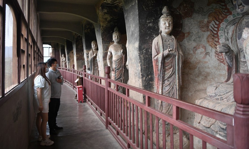 Tourists visit the Maijishan Grottoes in Tianshui City, northwest China's Gansu Province, June 9, 2022.Photo:Xinhua