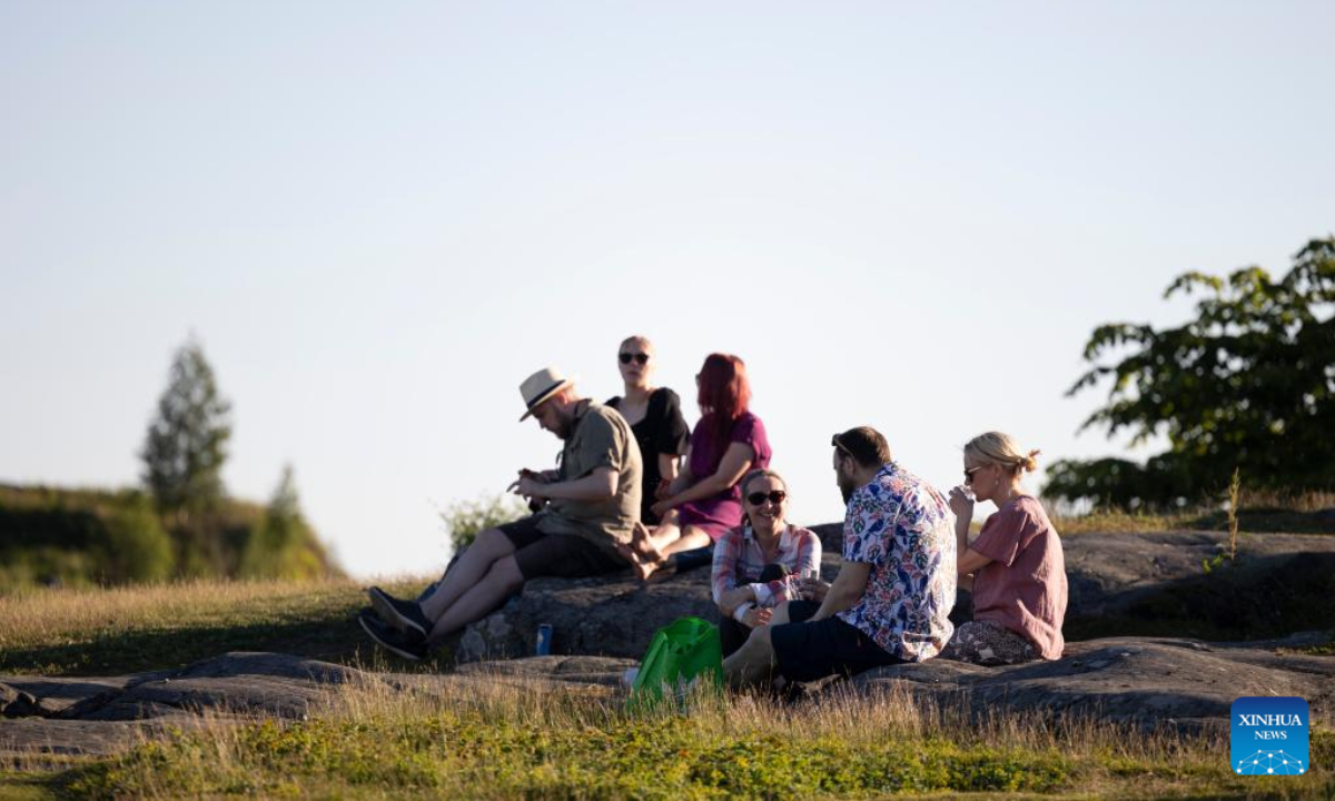 People celebrate Midsummer eve at Kaivopuisto Park in Helsinki, Finland, June 24, 2022. Midsummer Festival is an important festival and also one of the national holidays in Finland. Photo:Xinhua