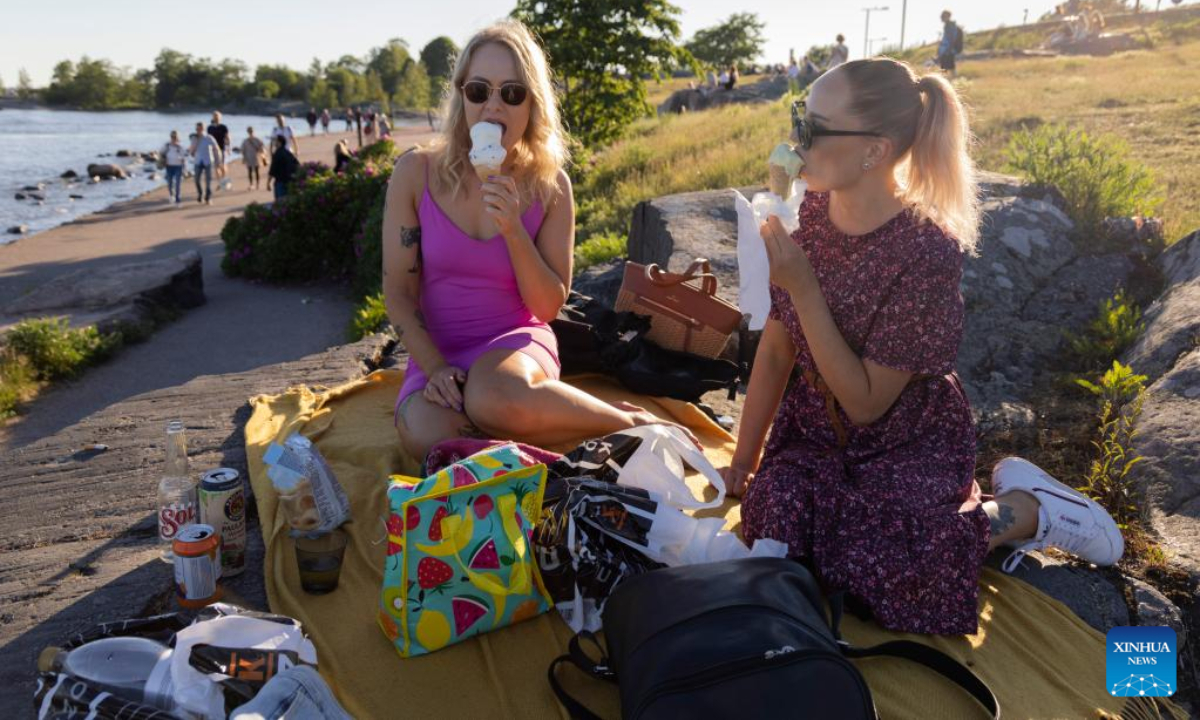 People celebrate Midsummer eve at Kaivopuisto Park in Helsinki, Finland, June 24, 2022. Midsummer Festival is an important festival and also one of the national holidays in Finland. Photo:Xinhua