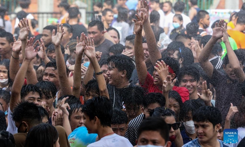 People celebrate the annual Wattah-Wattah Festival in San Juan City, the Philippines, June 24, 2022. The Wattah-Wattah Festival is celebrated with vigorous and boisterous street dancing, basaan (dousing of water), parades and concerts performed by local artists. (Xinhua/Rouelle Umali)