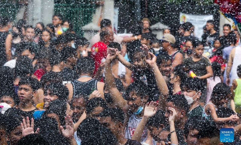 People celebrate the annual Wattah-Wattah Festival in San Juan City, the Philippines, June 24, 2022. The Wattah-Wattah Festival is celebrated with vigorous and boisterous street dancing, basaan (dousing of water), parades and concerts performed by local artists. (Xinhua/Rouelle Umali)