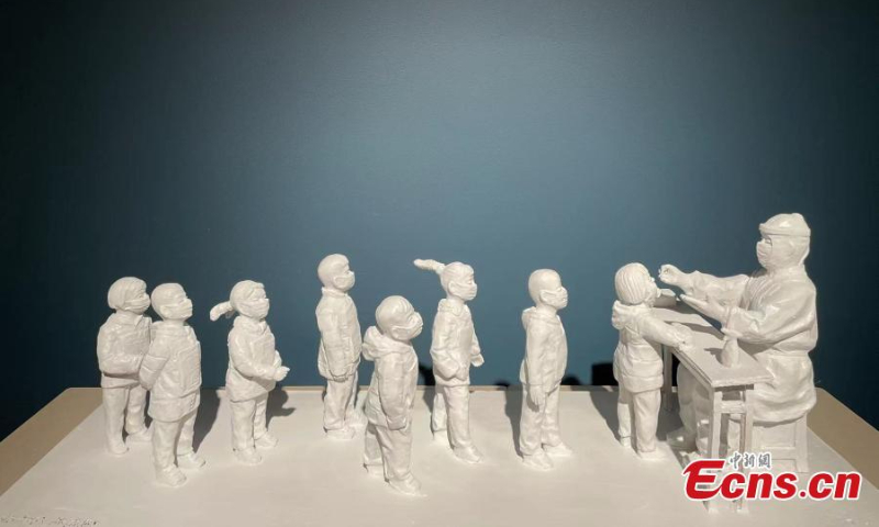 Photo shows Xu Hongfei’s Covid-themed sculpture, Children queue for the nucleic acid test, July 3, 2022. (Photo: Ecns.cn/Zhang Dongfang)