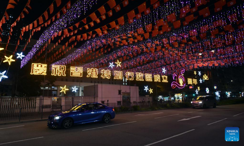 A street is adorned with colorful lights in Tsuen Wan, south China's Hong Kong, June 25, 2022. Hong Kong will celebrate the 25th anniversary of its return to the motherland. (Xinhua/Lo Ping Fai)