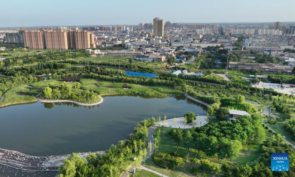 Aerial photo taken on July 8, 2022 shows Jiulong Wetland Park in Heyang County, northwest China's Shaanxi Province. Heyang County has made efforts in promoting ecological protection in recent years, with forest area reaching 775,000 mu (about 51,667 hectares) so far. Photo:Xinhua