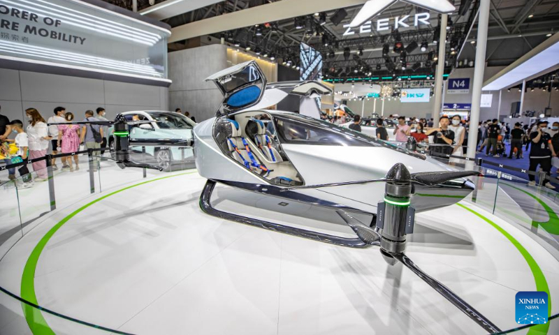 People visit the 2022 Chongqing International Auto Exhibition in southwest China's Chongqing Municipality, June 25, 2022.