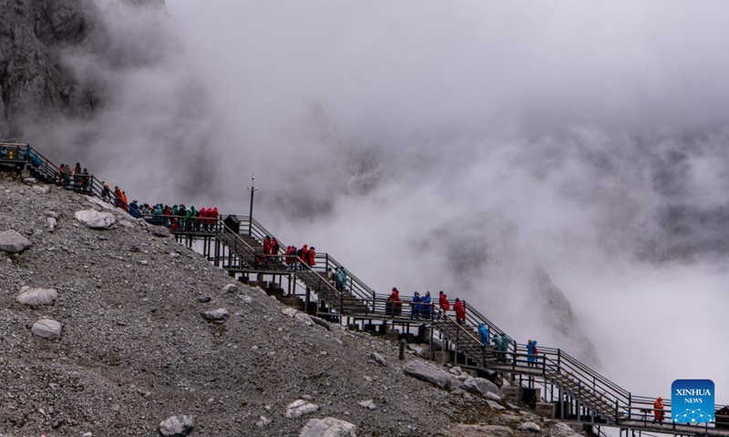 Tourists visit the scenic area of Yulong Snow Mountain in Lijiang City, southwest China's Yunnan Province, June 26, 2022.Photo:Xinhua