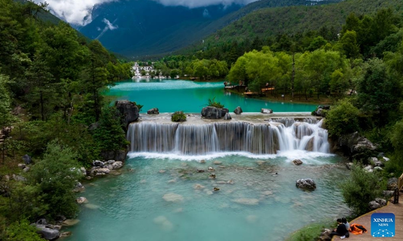 Tourists visit Blue Moon Valley at the foot of the Yulong Snow Mountain in Lijiang City, southwest China's Yunnan Province, June 26, 2022.Photo:Xinhua