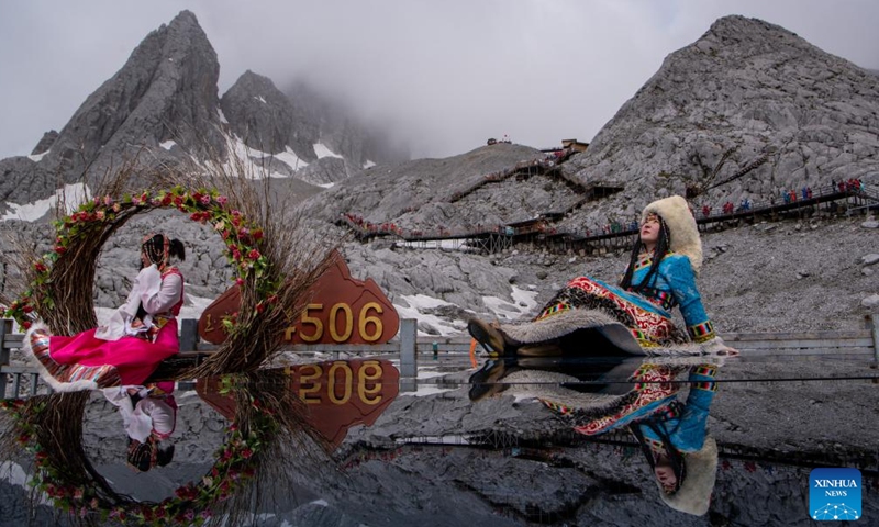 Tourists visit the scenic area of Yulong Snow Mountain in Lijiang City, southwest China's Yunnan Province, June 26, 2022.Photo:Xinhua